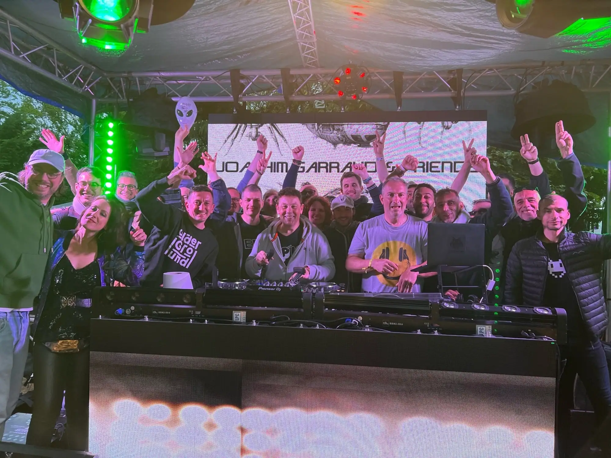 Paul Thenail on stage next to Joachim Garraud mixing at a festival with Joachim Garraud and album collaborators